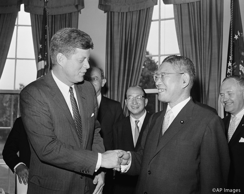 President John Kennedy shakes hands with Japanese Prime Minister Hayato Ikeda, at right, at the White House in Washington, June 21, 1961. (AP Photo)