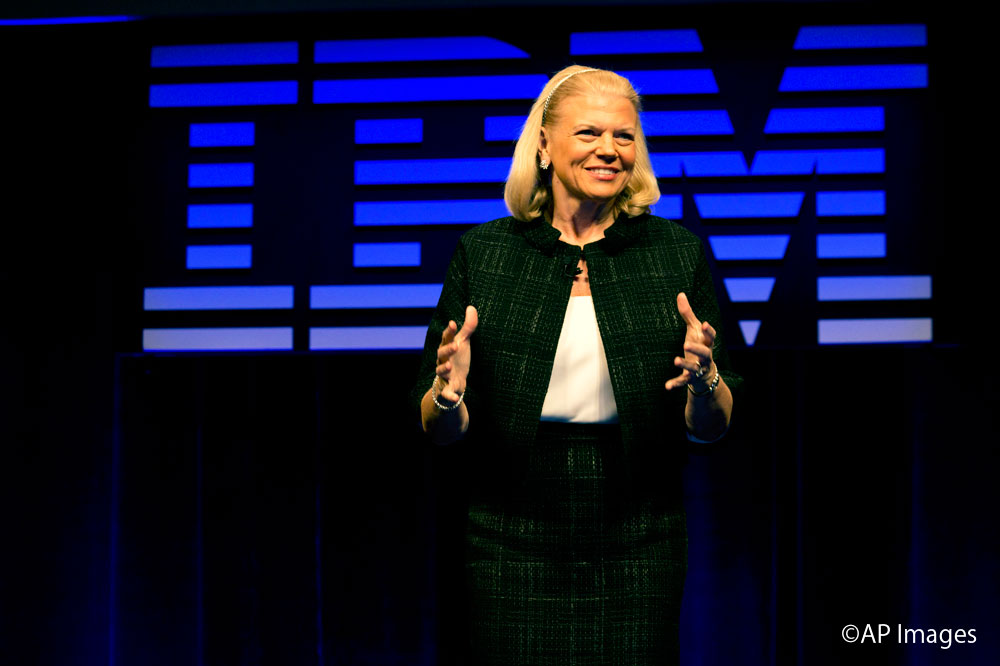 IBM CEO Ginni Rometty responds to a question during a news conference at IBM Watson headquarters, in New York, Thursday, April 30, 2015. Apple, IBM and Japanese insurance and bank holding company Japan Post have formed a partnership to improve the lives of elderly people in the country. The program will provide iPads with apps designed to help seniors manage day-to-day lives and keep in touch with family members. (AP Photo/Richard Drew)