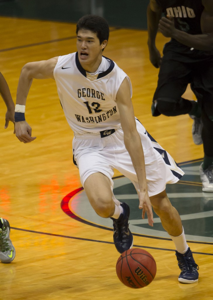 George Washington forward Yuta Watanabe (12) dribbles the basketball up court in the second half of an NCAA college basketball game at the Diamond Head Classic on Monday, Dec. 22, 2014, in Honolulu. George Washington beat Ohio University (AP Photo/Eugene Tanner)