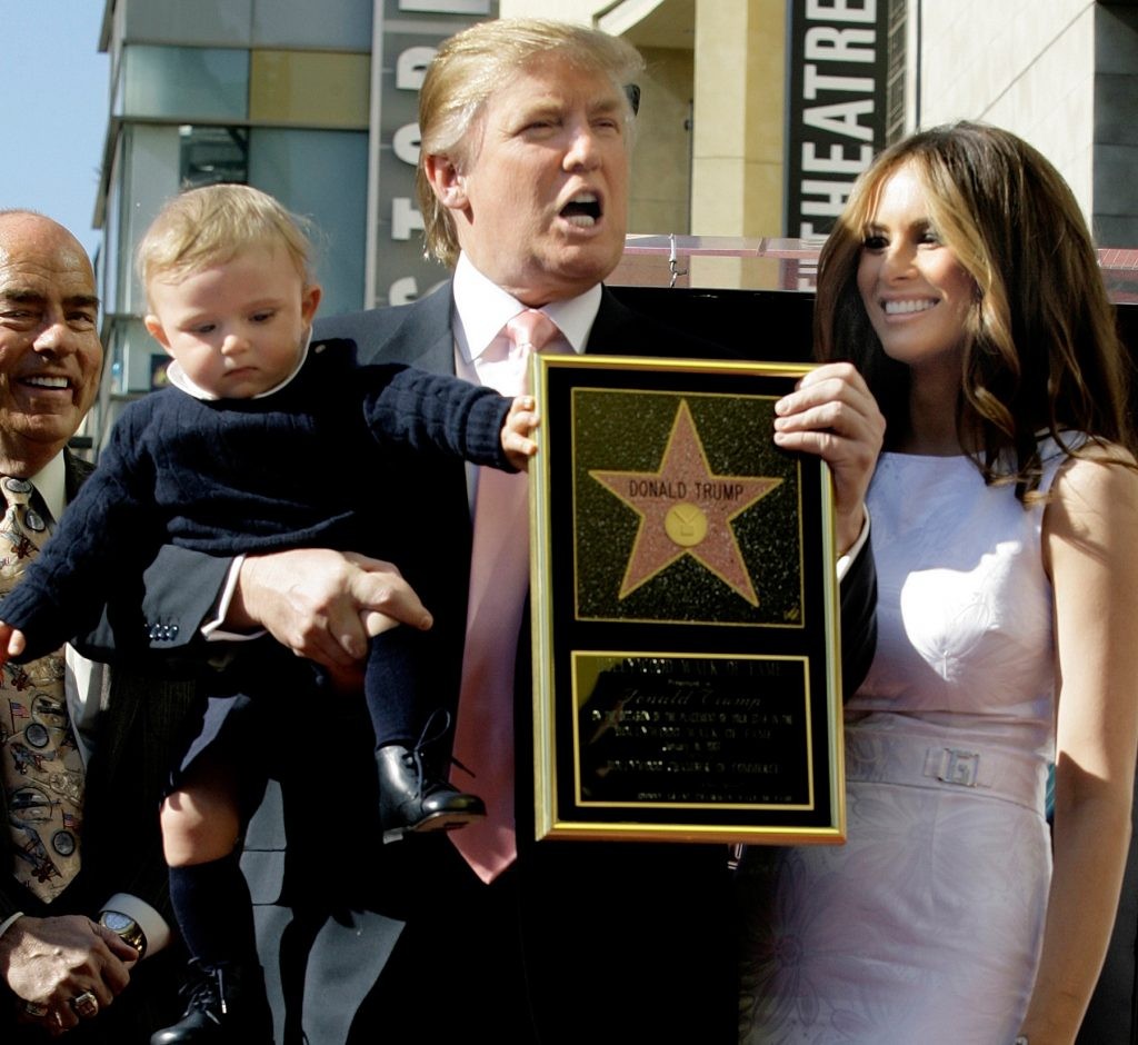 Donald Trump, Melania Trump and their son, Barron, pose for a photo after Donald Trump received a star on the Hollywood Walk of Fame. (© AP Images)