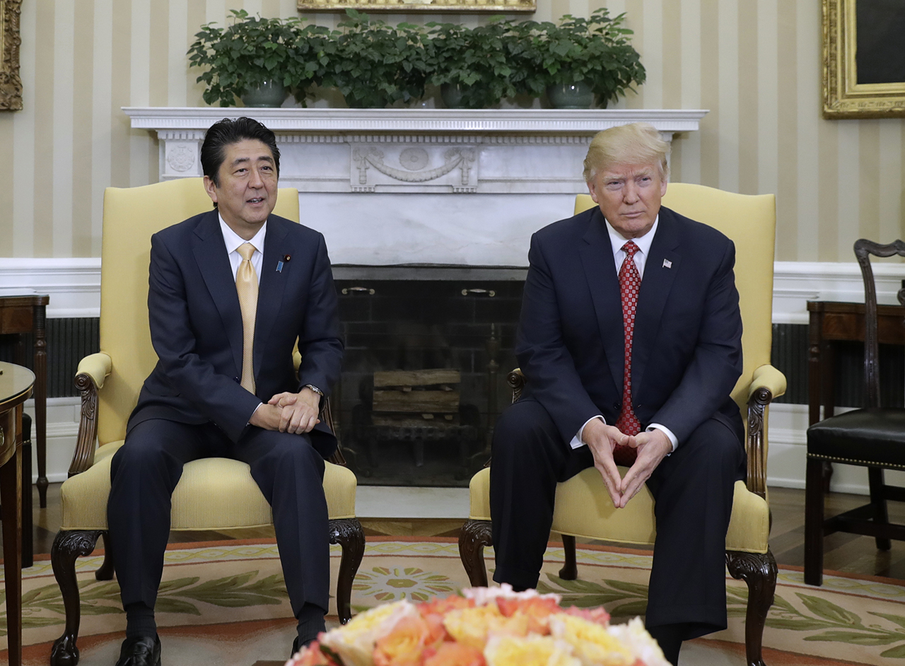 President Donald Trump meets with Japanese Prime Minister Shinzo Abe in the Oval Office of the White House in Washington, Friday, Feb. 10, 2017. (AP Photo/Evan Vucci)