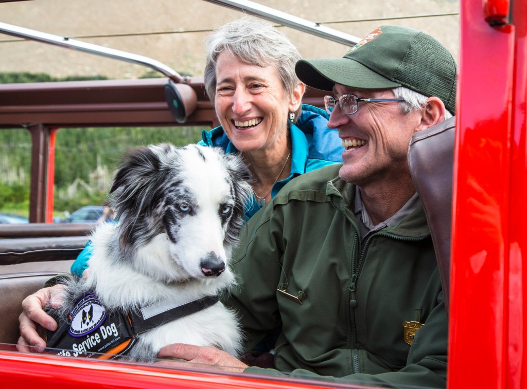Gracie poses with former Secretary of the Interior Sally Jewell and ranger Mark Biel. (NPS/Jacob W. Frank)