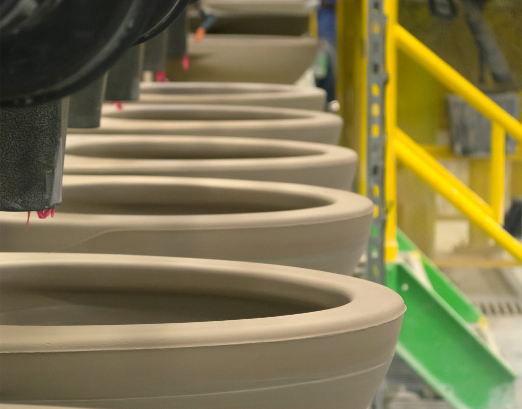 Toilets on the TOTO USA production line. TOTO's decision to build toilets in the U.S. enables the Japanese company to work with U.S. engineers and save costs. (TOTO USA)