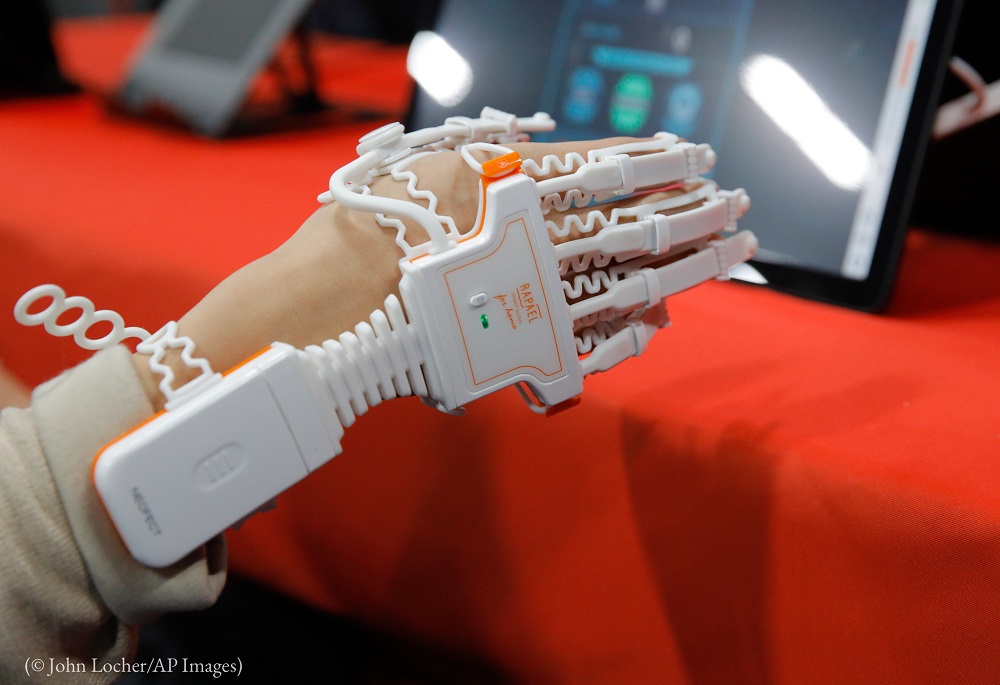 The Neofect Smart Glove stroke-rehabilitation device is demonstrated at CES 2020 (© John Locher/AP Images)