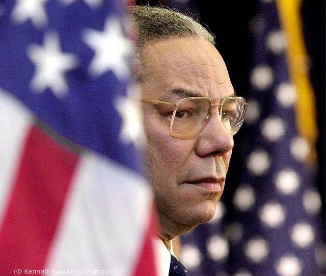 Secretary of State Colin Powell looks on as President George W. Bush speaks to State Department employees in 2001. The connections Powell made with staff made him more than a boss. (© Kenneth Lambert/AP Images)
