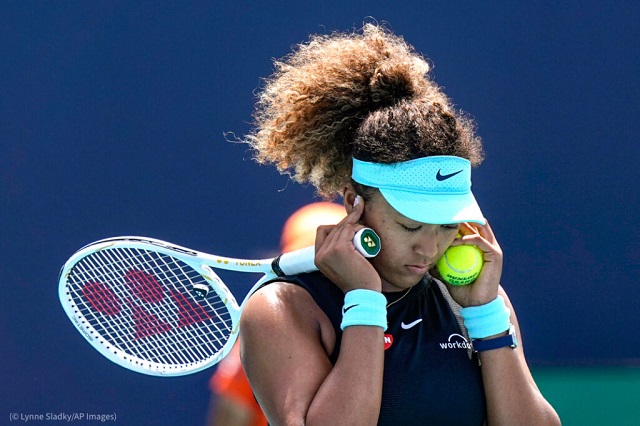 Naomi Osaka covers her ears during a match in Miami Gardens, Florida, on March 31. (© Lynne Sladky/AP Images)