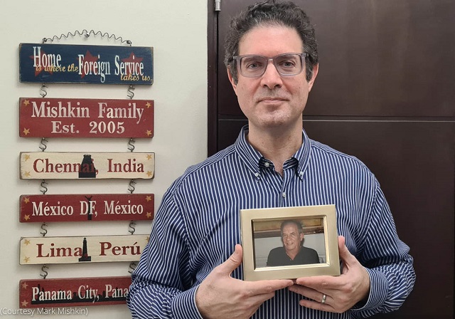 Mark Mishkin holds a photo of his grandfather. (Courtesy Mark Mishkin)