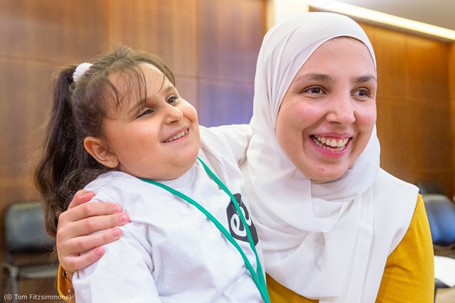 Minkara embraces a participant of ETI’s summer programs in Tripoli, Lebanon, in July 2019. (© Tom Fitzsimmons)