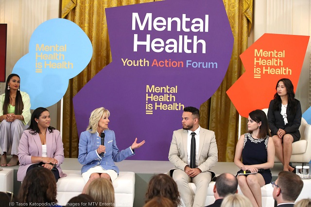 Cynthia Yue, top right, listens to first lady Jill Biden speak at a mental health youth forum at the White House in May. (© Tasos Katopodis/Getty Images for MTV Entertainment)