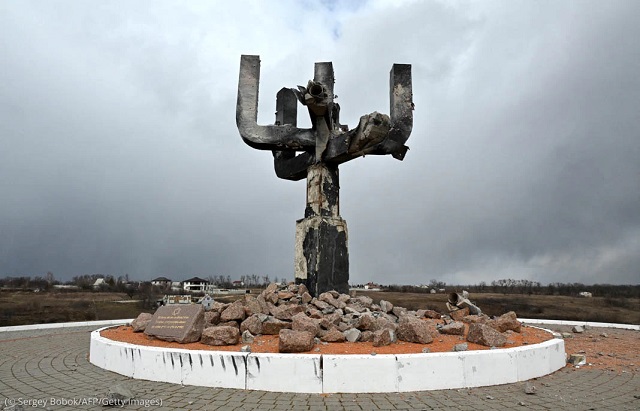 Russian shelling in March damaged a menorah-shaped monument that marks the location of a mass killing of Jewish people by Nazis during World War II. The monument is located at the entrance of the Drobitsky Yar Holocaust Memorial complex on the outskirts of Kharkiv, Ukraine. (© Sergey Bobok/AFP/Getty Images)