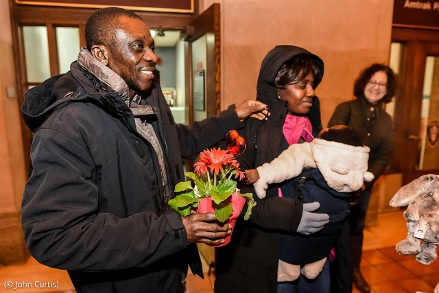 A Congolese family seeking asylum is greeted by Integrated Refugee & Immigrant Services and its co-sponsors in New Haven, Connecticut. (© John Curtis)